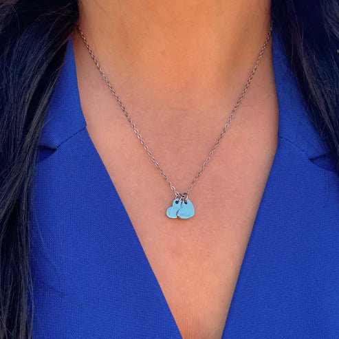 Silver Necklace Featuring Two Heart Charms - Private Gallery Boutique