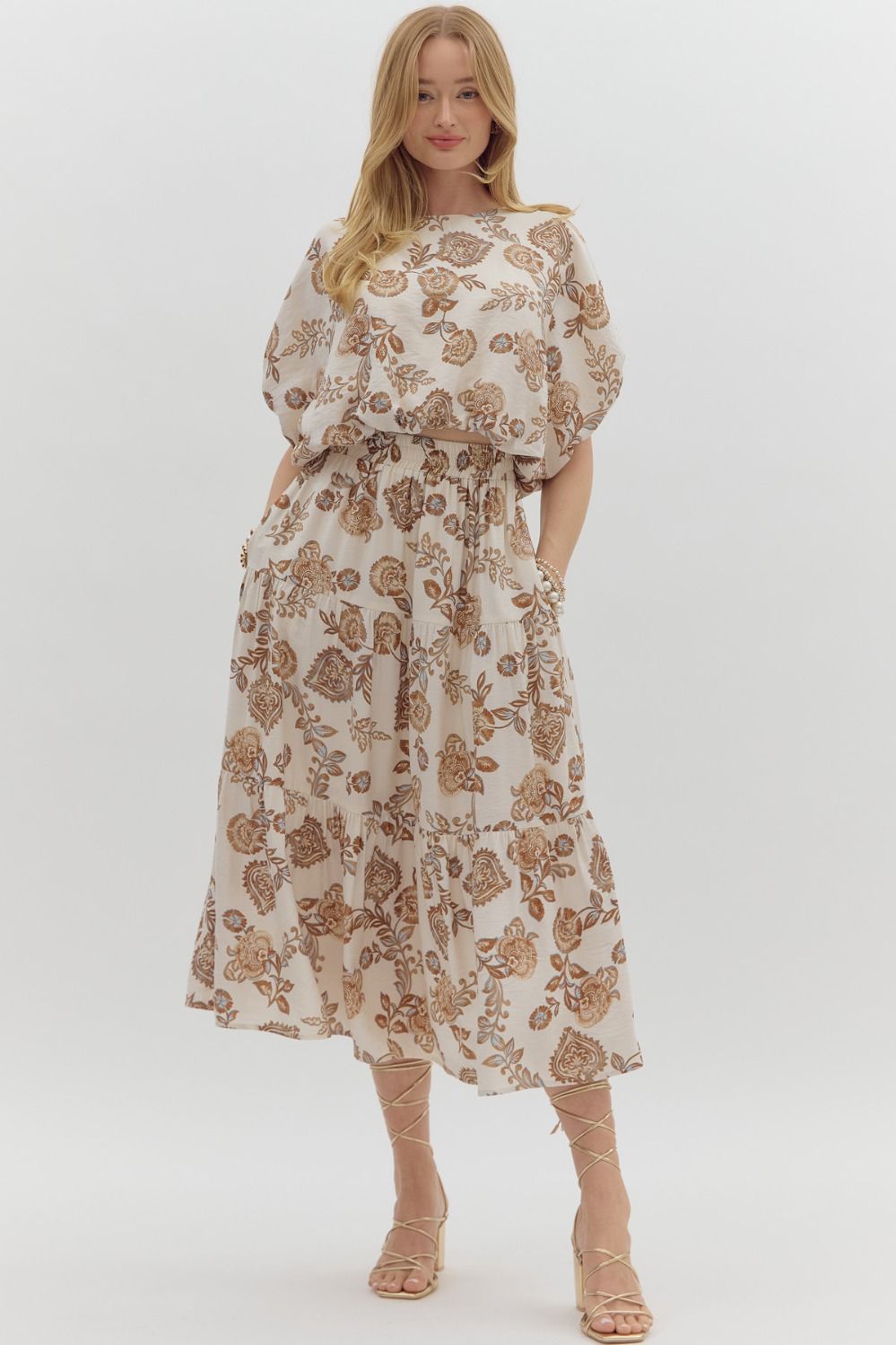 Woman wearing a floral set on a white background
