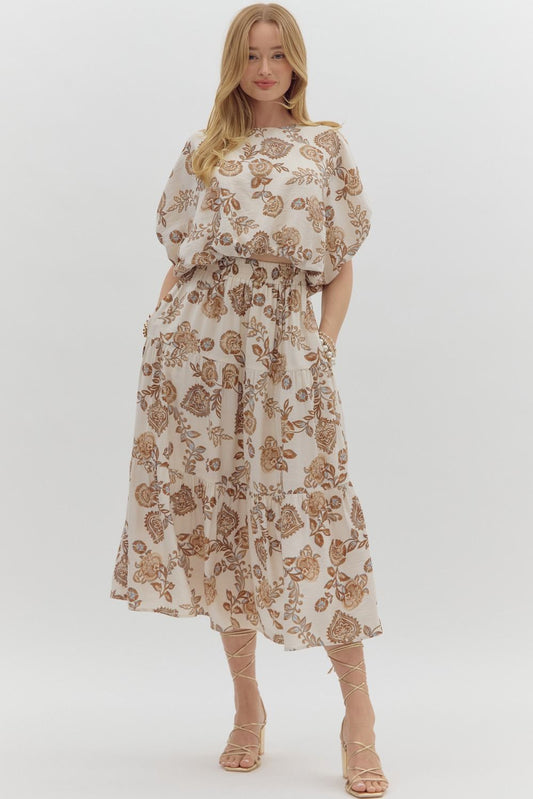 Woman wearing a floral set on a white background